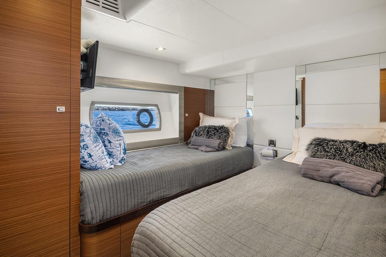 a bedroom with two beds aboard THRU & THRU Yacht for Sale