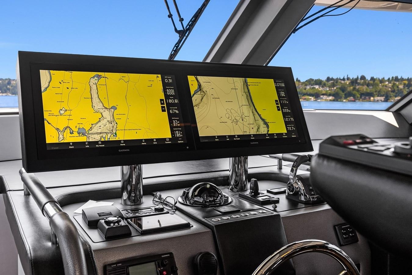 a couple of monitors on a car aboard THRU & THRU Yacht for Sale