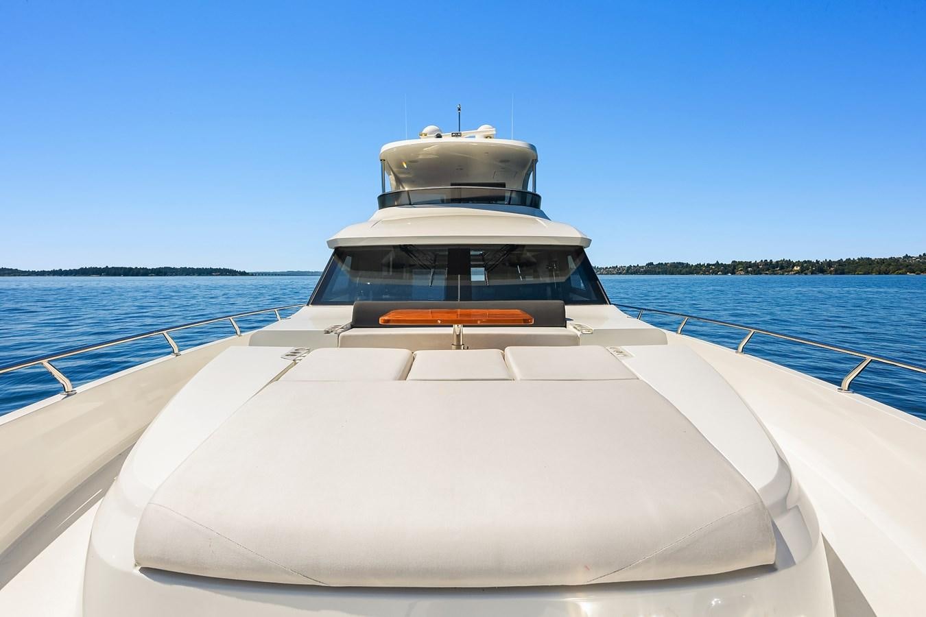 a white boat on a body of water aboard THRU & THRU Yacht for Sale