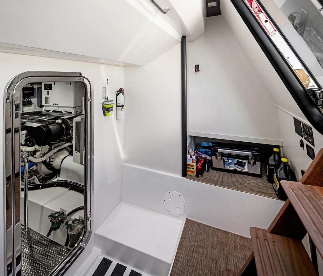 a room with a large mirror and a table with objects on it aboard THRU & THRU Yacht for Sale