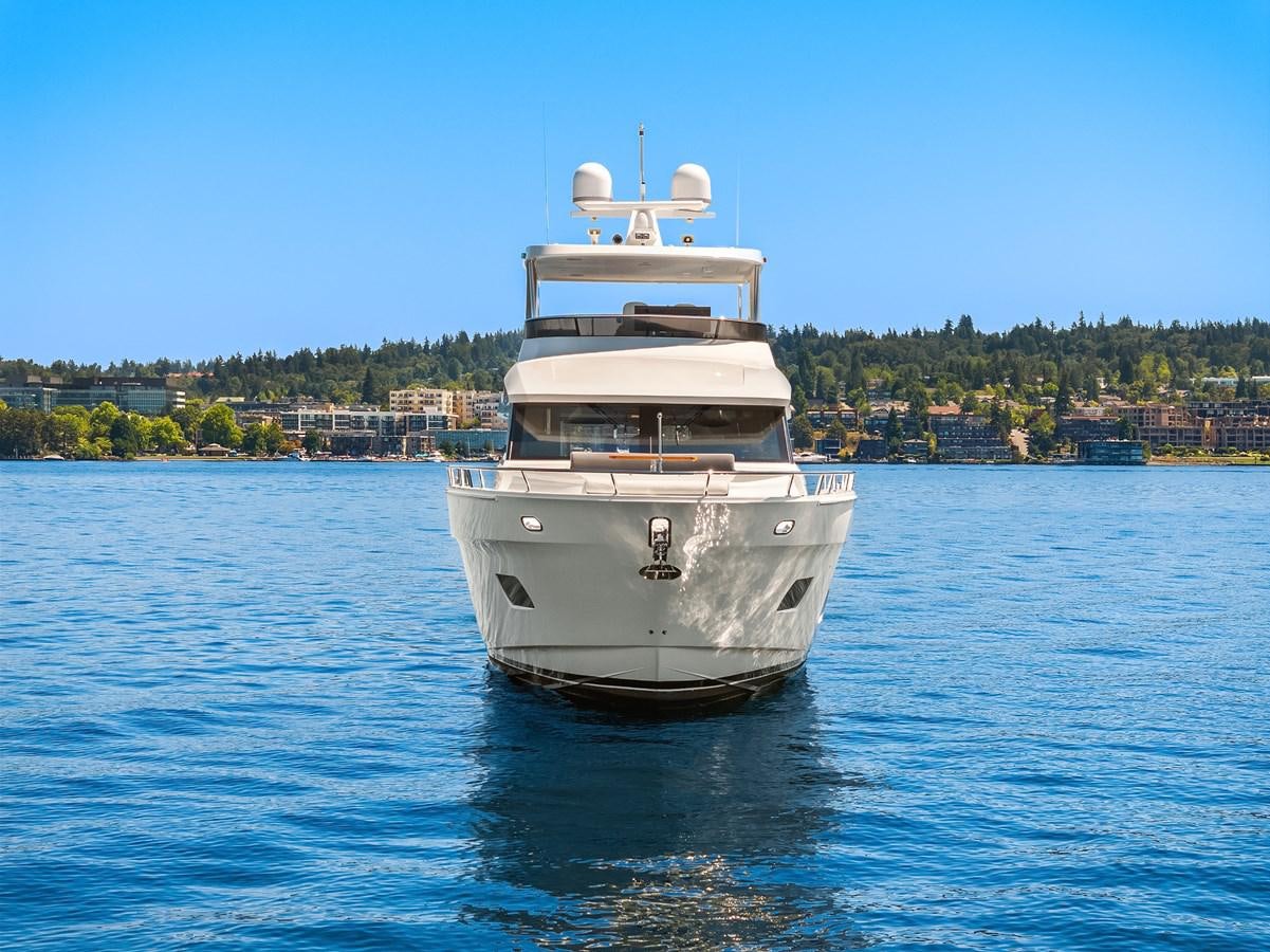 a white boat in the water aboard THRU & THRU Yacht for Sale