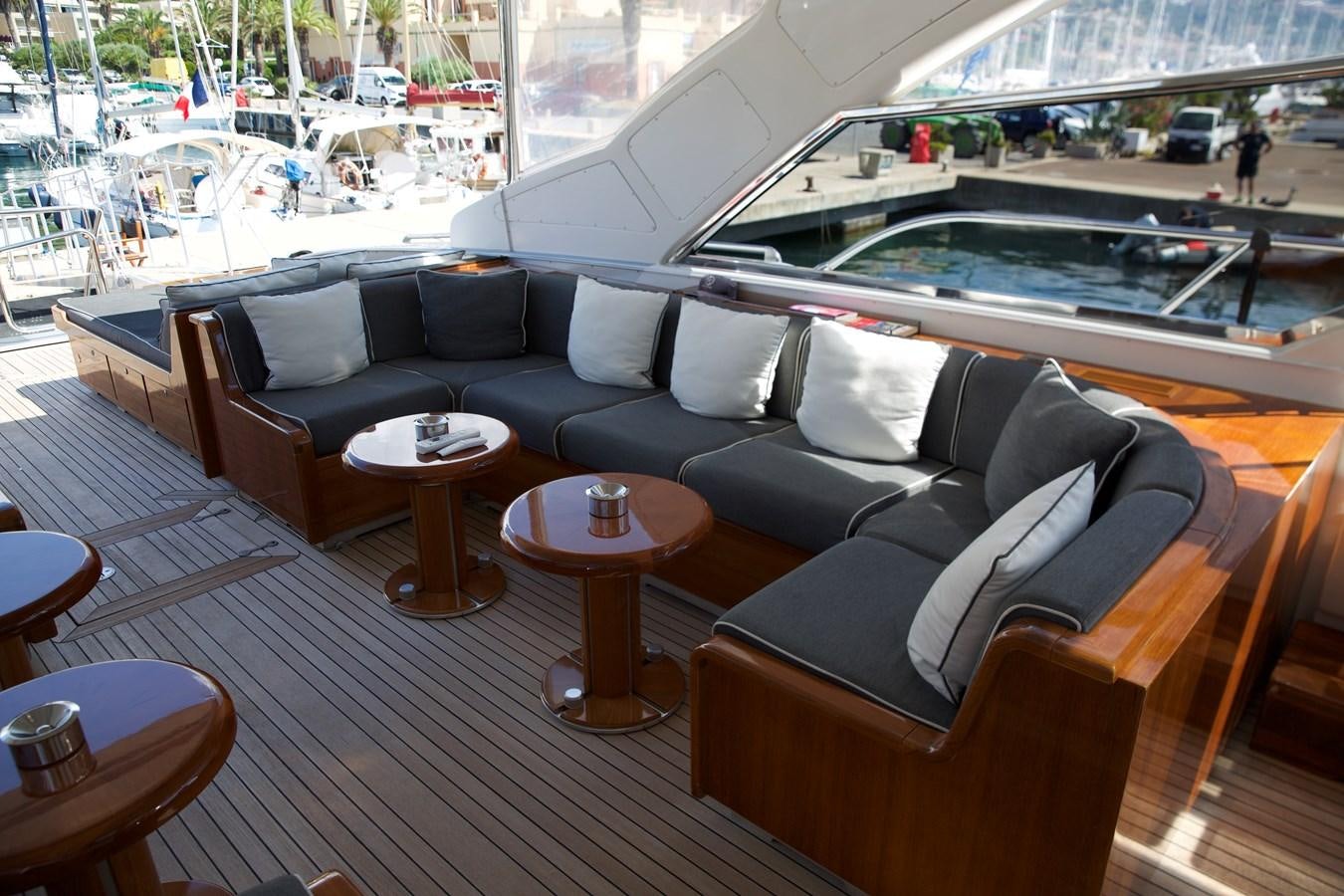 a room with a couch and a table and a window aboard SILVER SKY Yacht for Sale