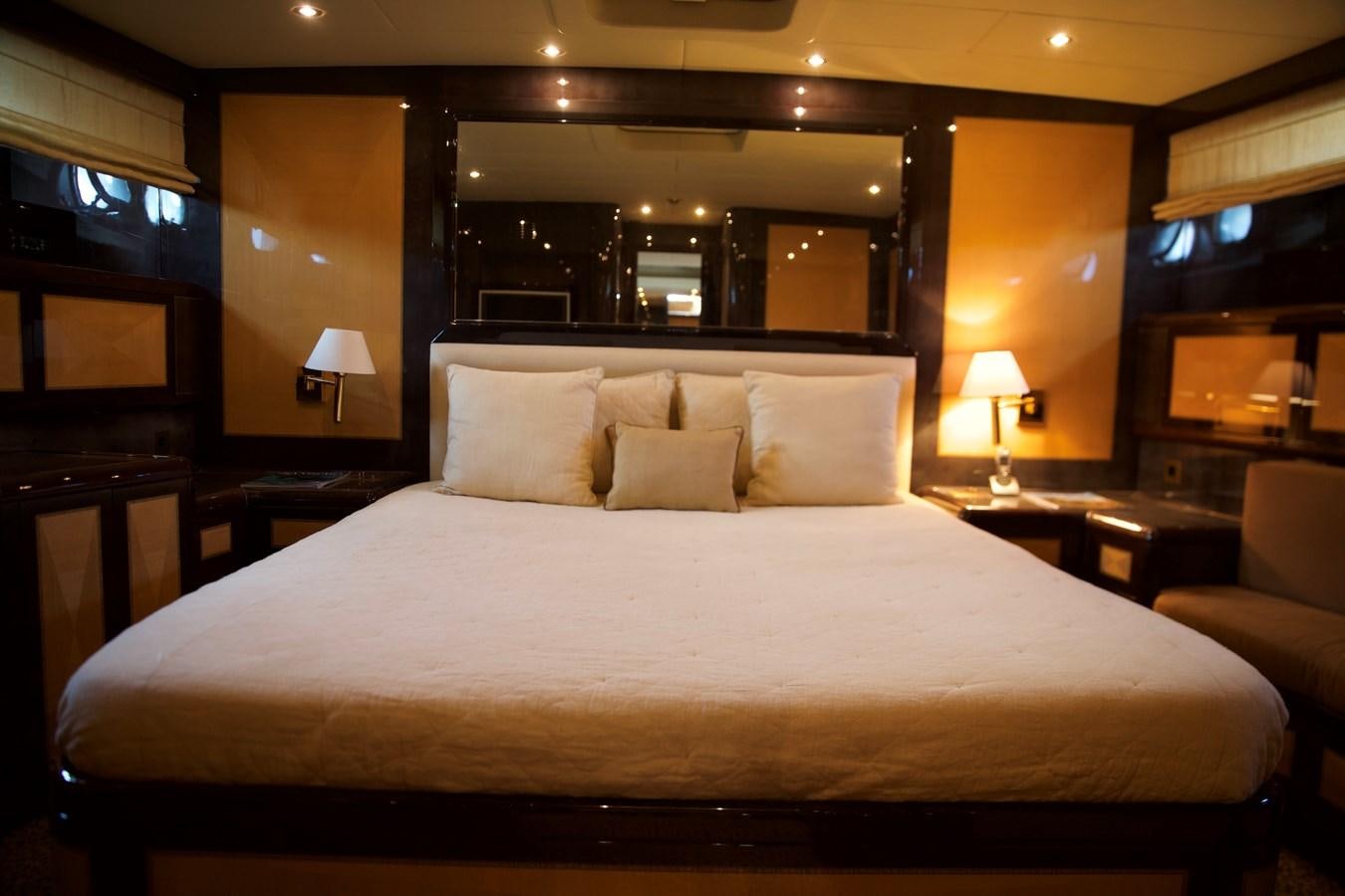 a bed with white sheets aboard SILVER SKY Yacht for Sale