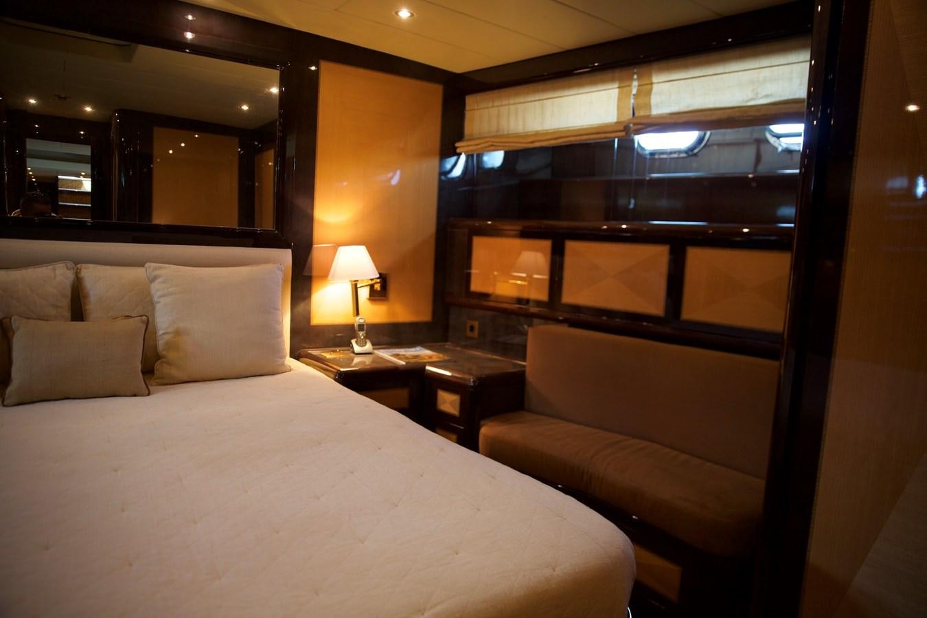 a bed with a white sheet and pillows in a hotel room aboard SILVER SKY Yacht for Sale