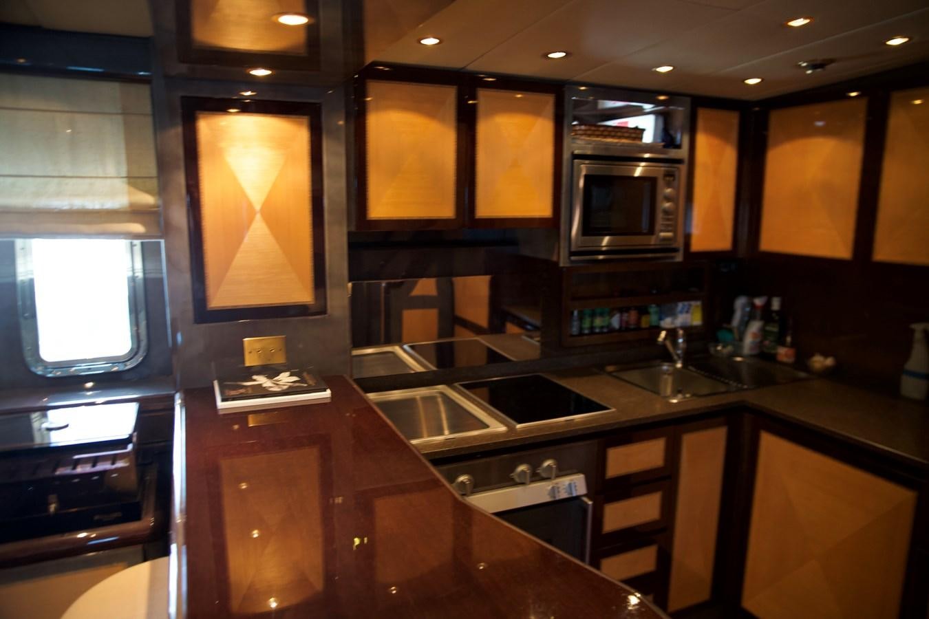 a kitchen with a large tv aboard SILVER SKY Yacht for Sale