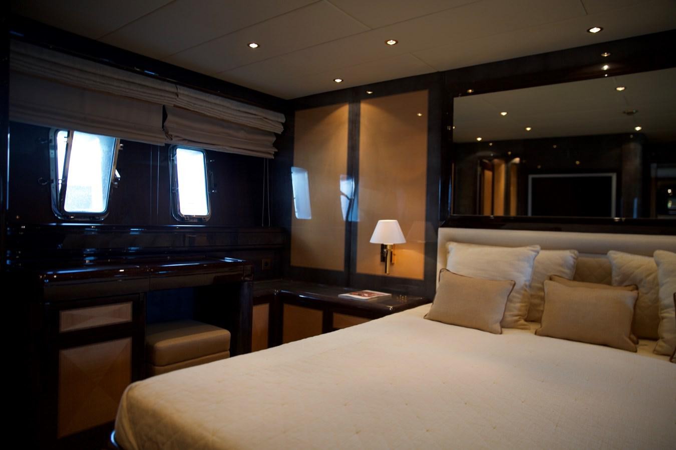 a hotel room with a bed and desk aboard SILVER SKY Yacht for Sale