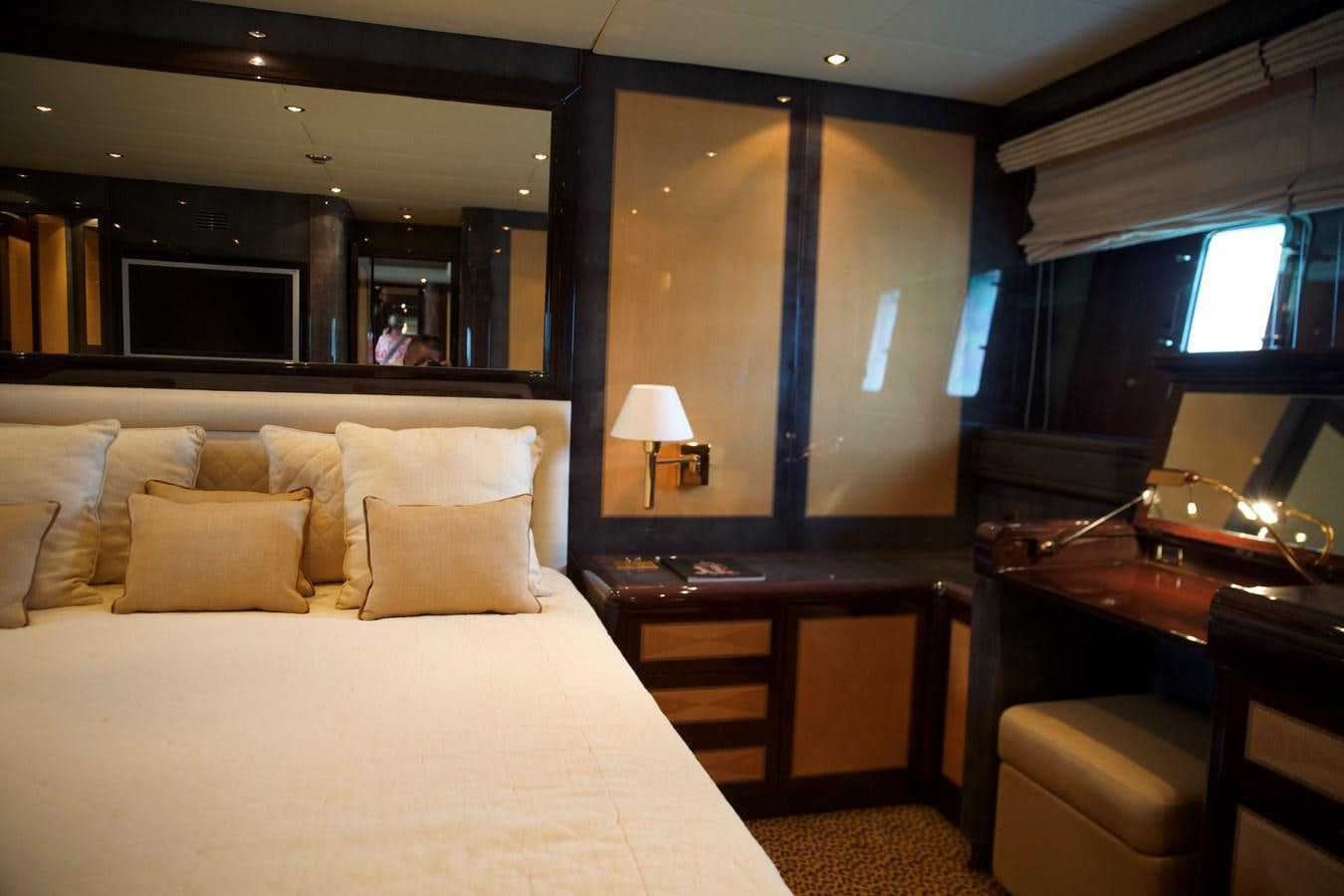 a hotel room with a bed and desk aboard SILVER SKY Yacht for Sale