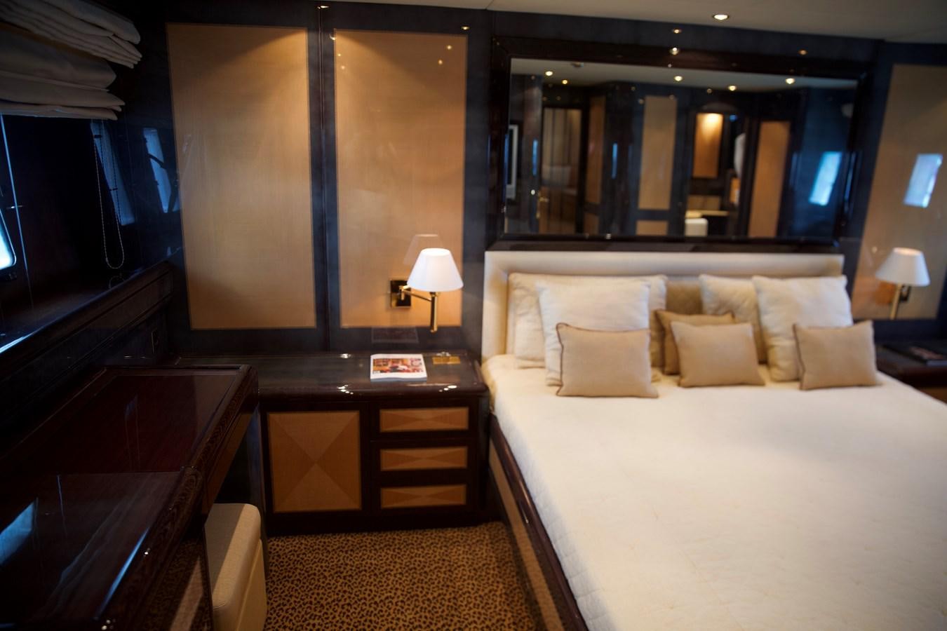 a hotel room with a bed and a desk aboard SILVER SKY Yacht for Sale