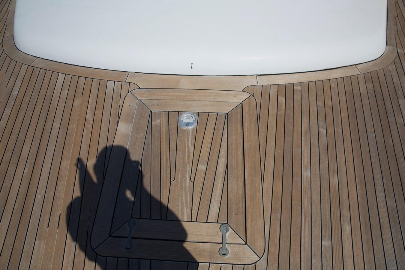 a black object on a wooden surface aboard SILVER SKY Yacht for Sale