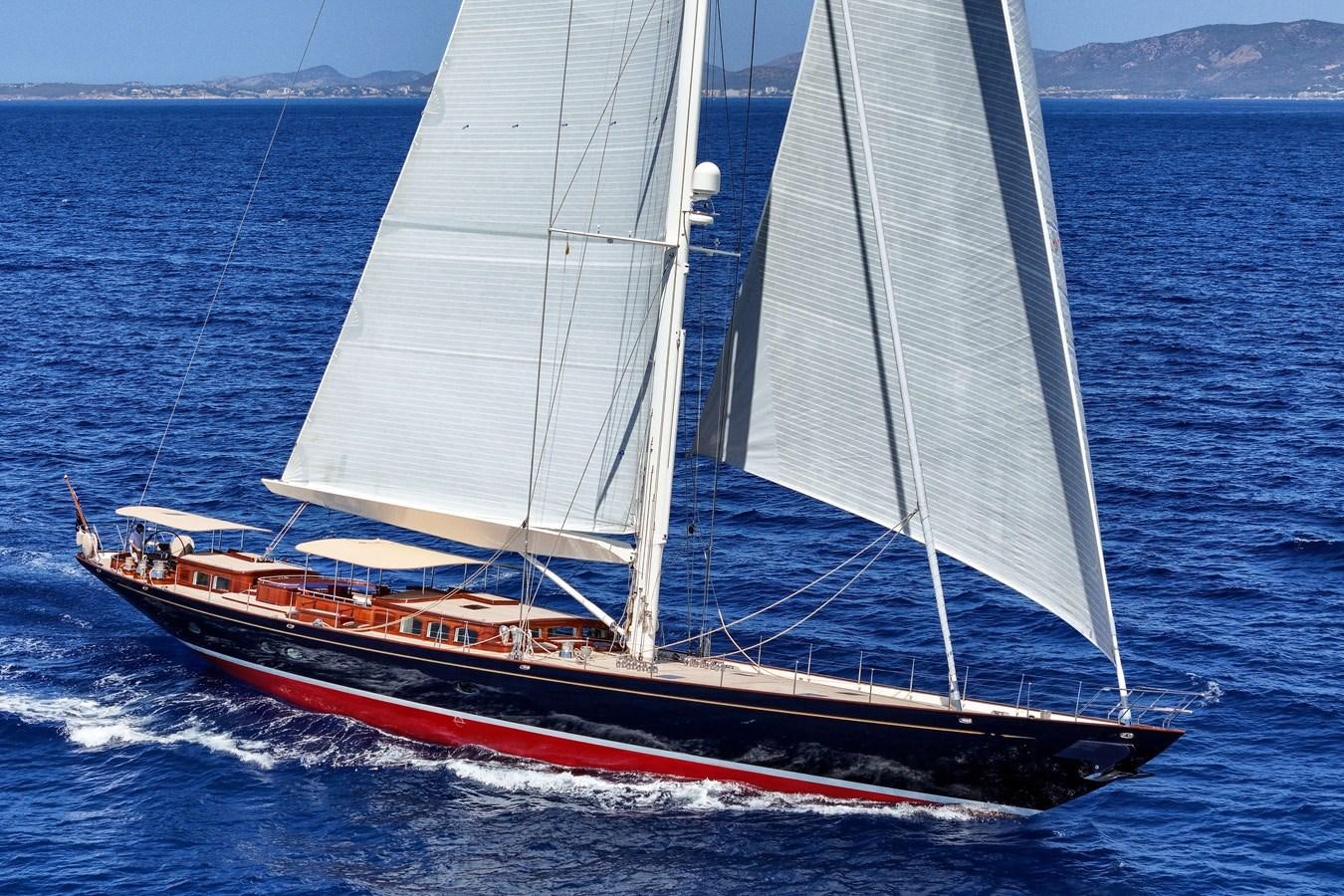 a red and white sailboat on the water aboard ATALANTE Yacht for Sale