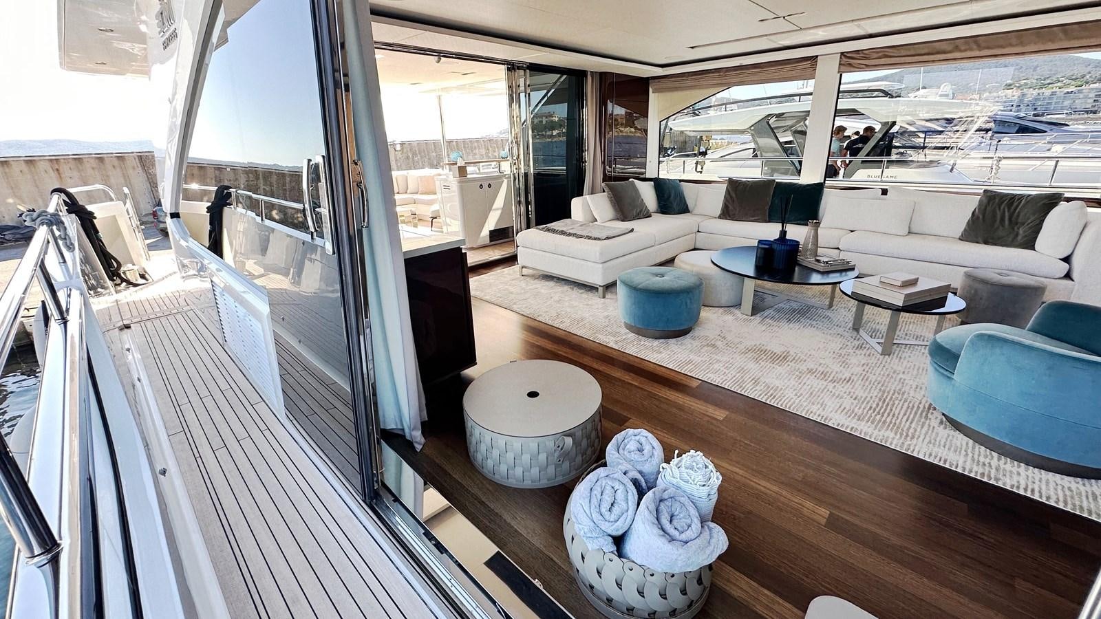 a room with a couch and a table and a rug aboard GHOST Yacht for Sale