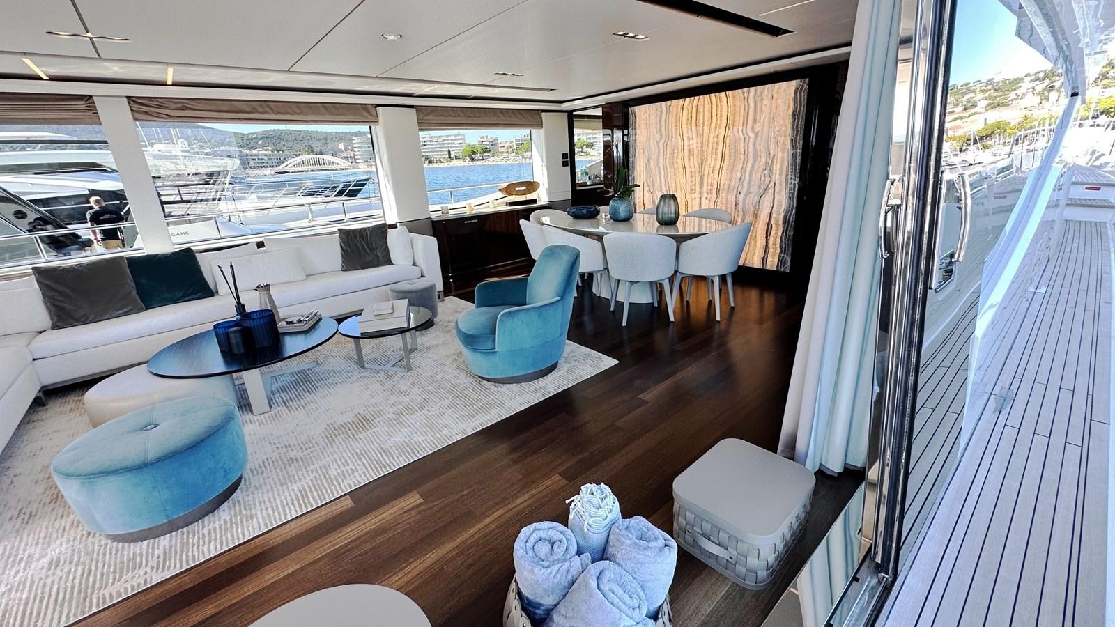 a room with a table chairs and a window aboard GHOST Yacht for Sale
