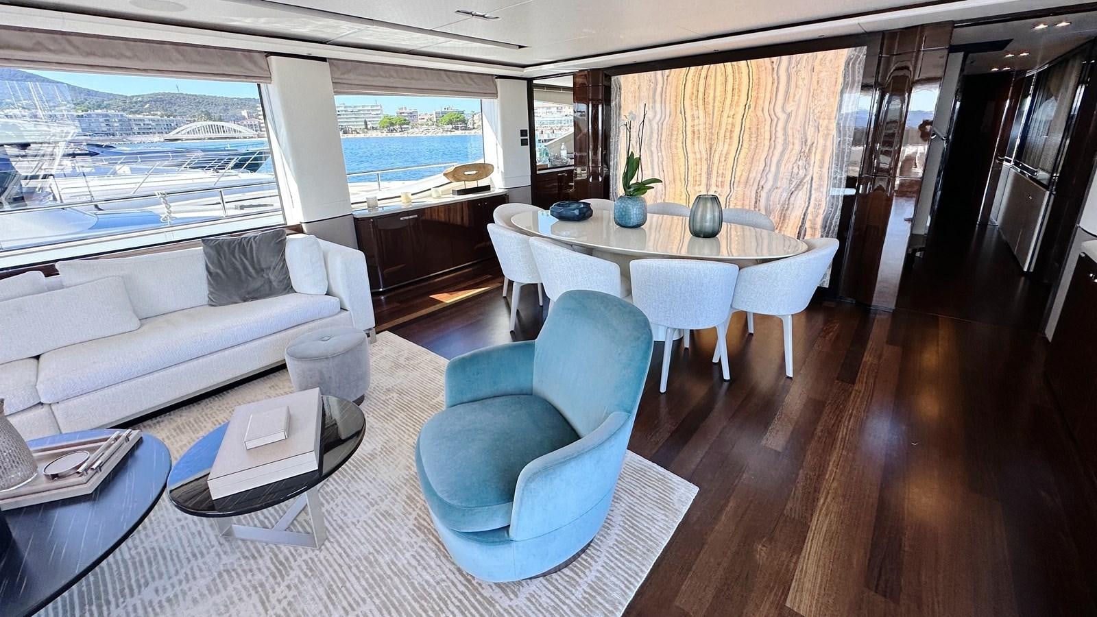 a living room with a table and chairs aboard GHOST Yacht for Sale