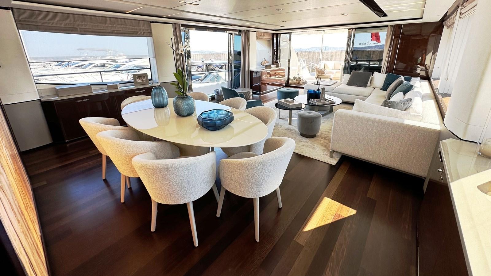 a room with a table and chairs aboard GHOST Yacht for Sale