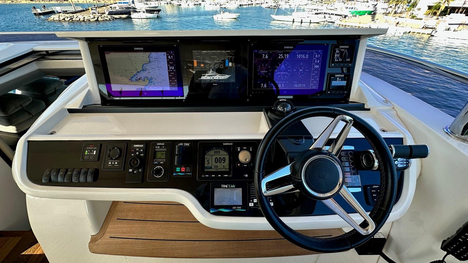 a car with a screen and a steering wheel aboard GHOST Yacht for Sale