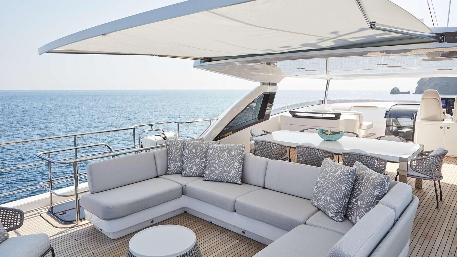 a white couch on a boat aboard GHOST Yacht for Sale