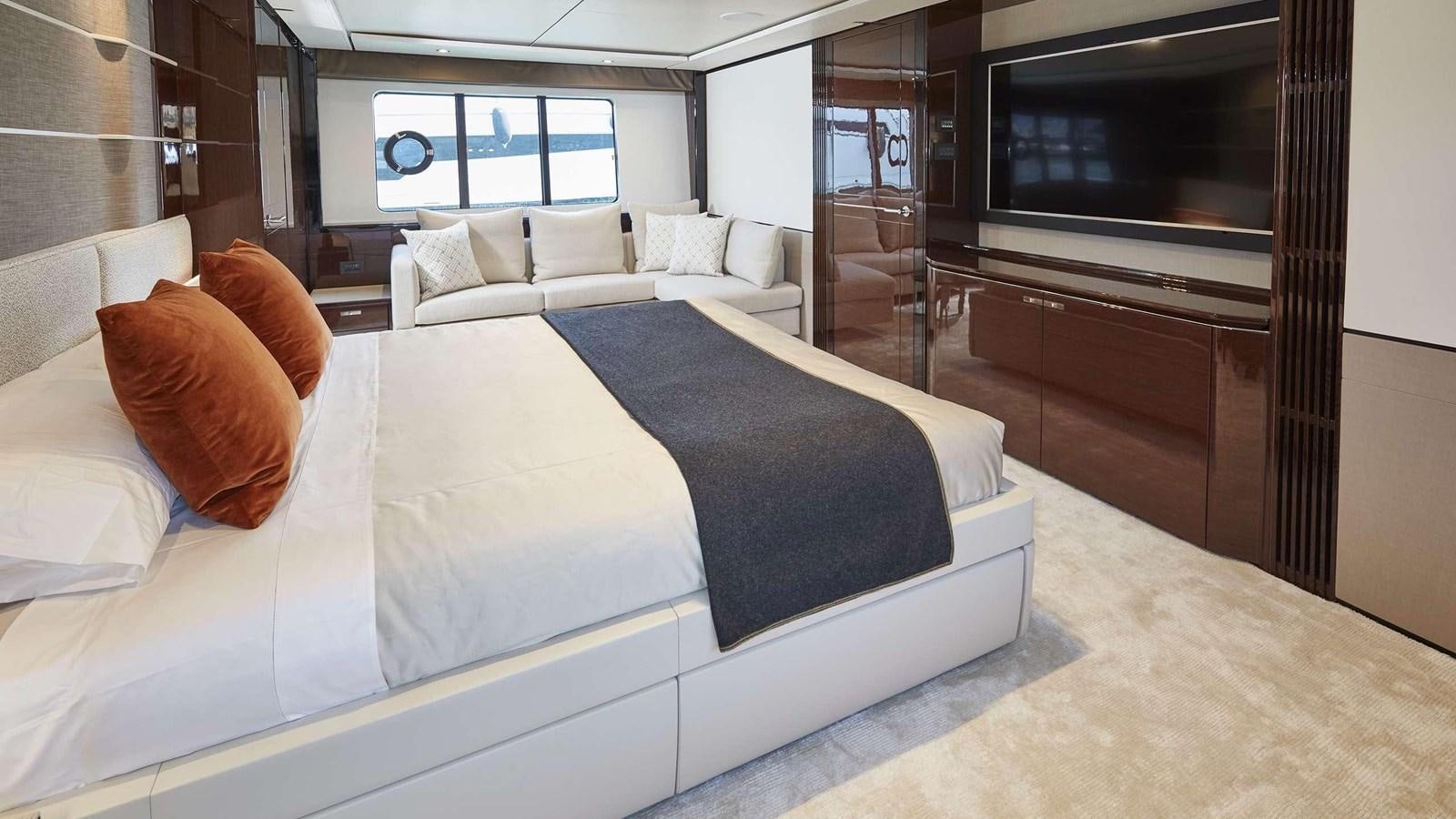 a bed with a blue sheet aboard GHOST Yacht for Sale