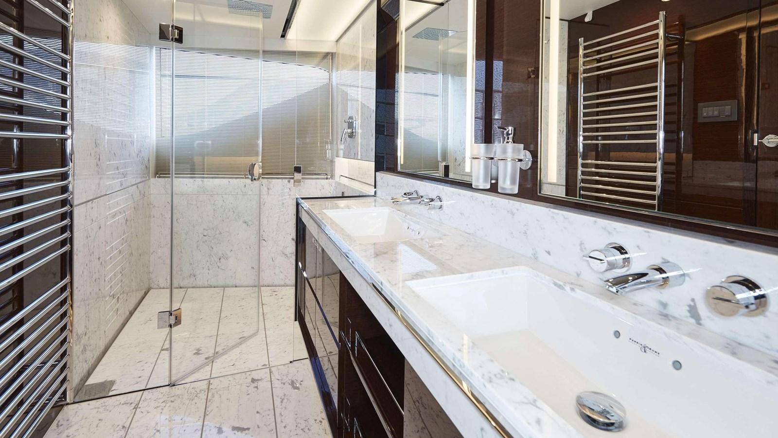 a bathroom with a sink and a mirror aboard GHOST Yacht for Sale