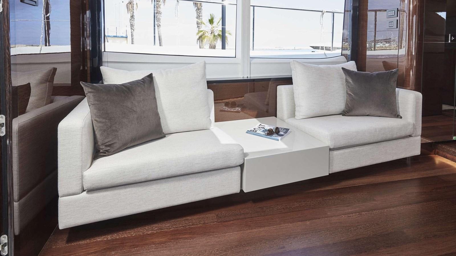 a couch with pillows aboard GHOST Yacht for Sale