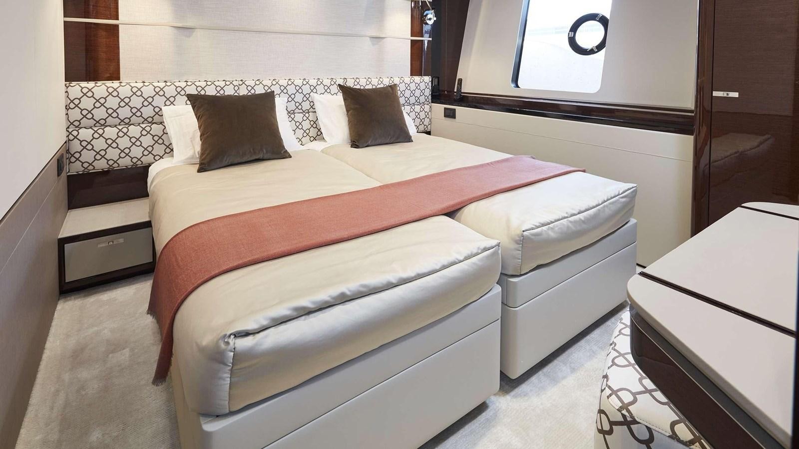 a bed with white sheets aboard GHOST Yacht for Sale