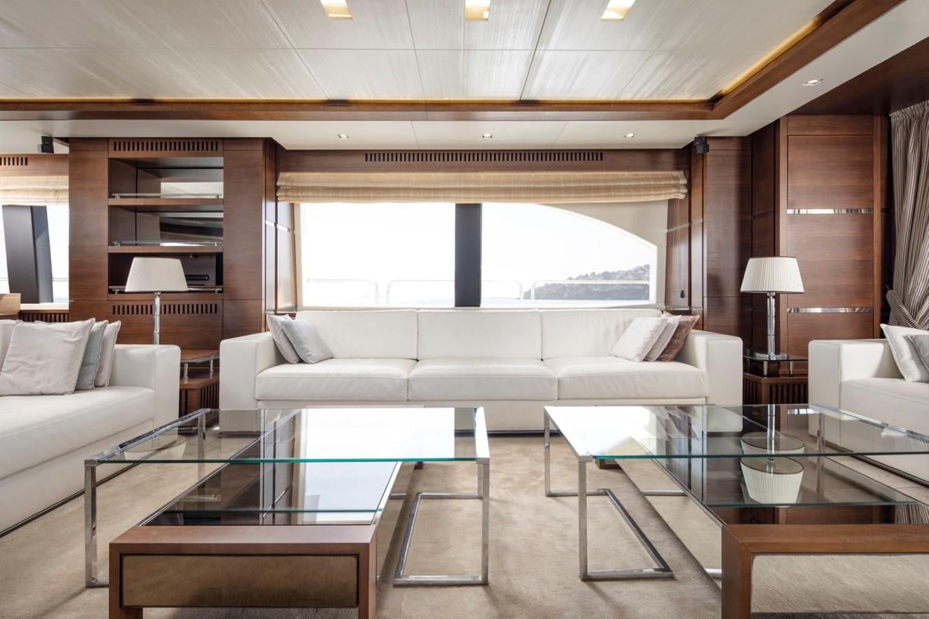 a living room with a glass table aboard NIMIR Yacht for Sale