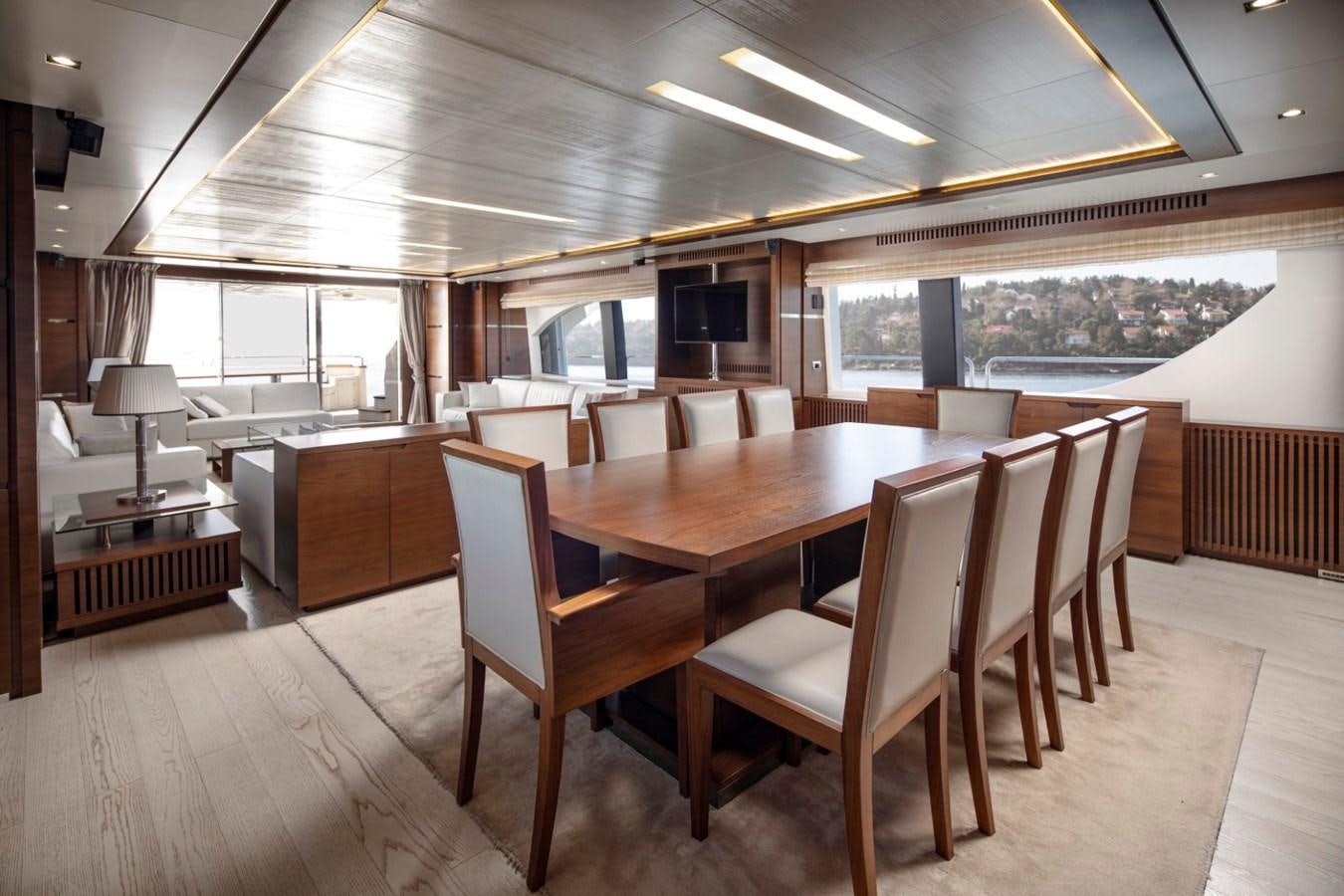 a room with a table and chairs aboard NIMIR Yacht for Sale