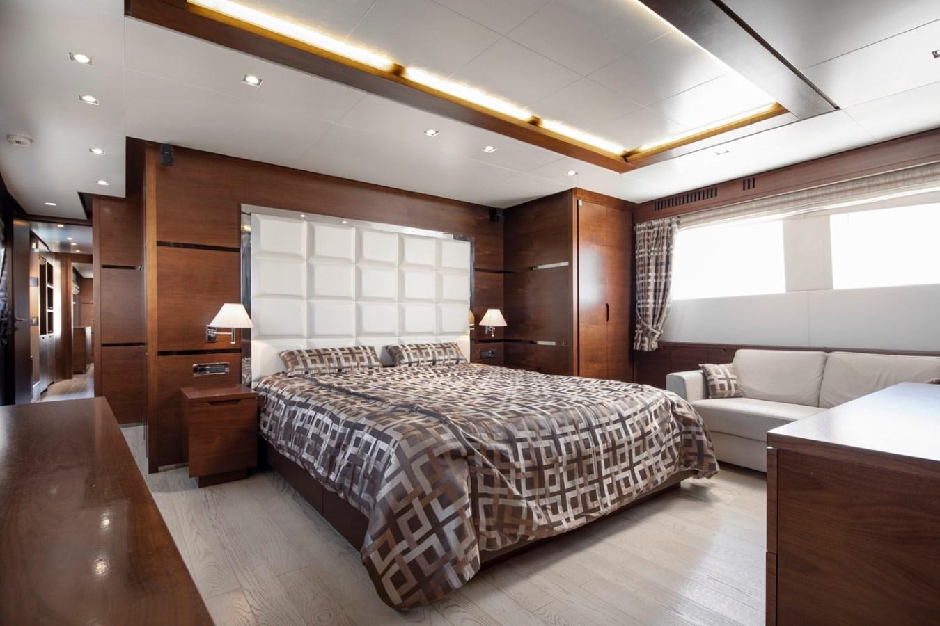 a bedroom with a large bed aboard NIMIR Yacht for Sale