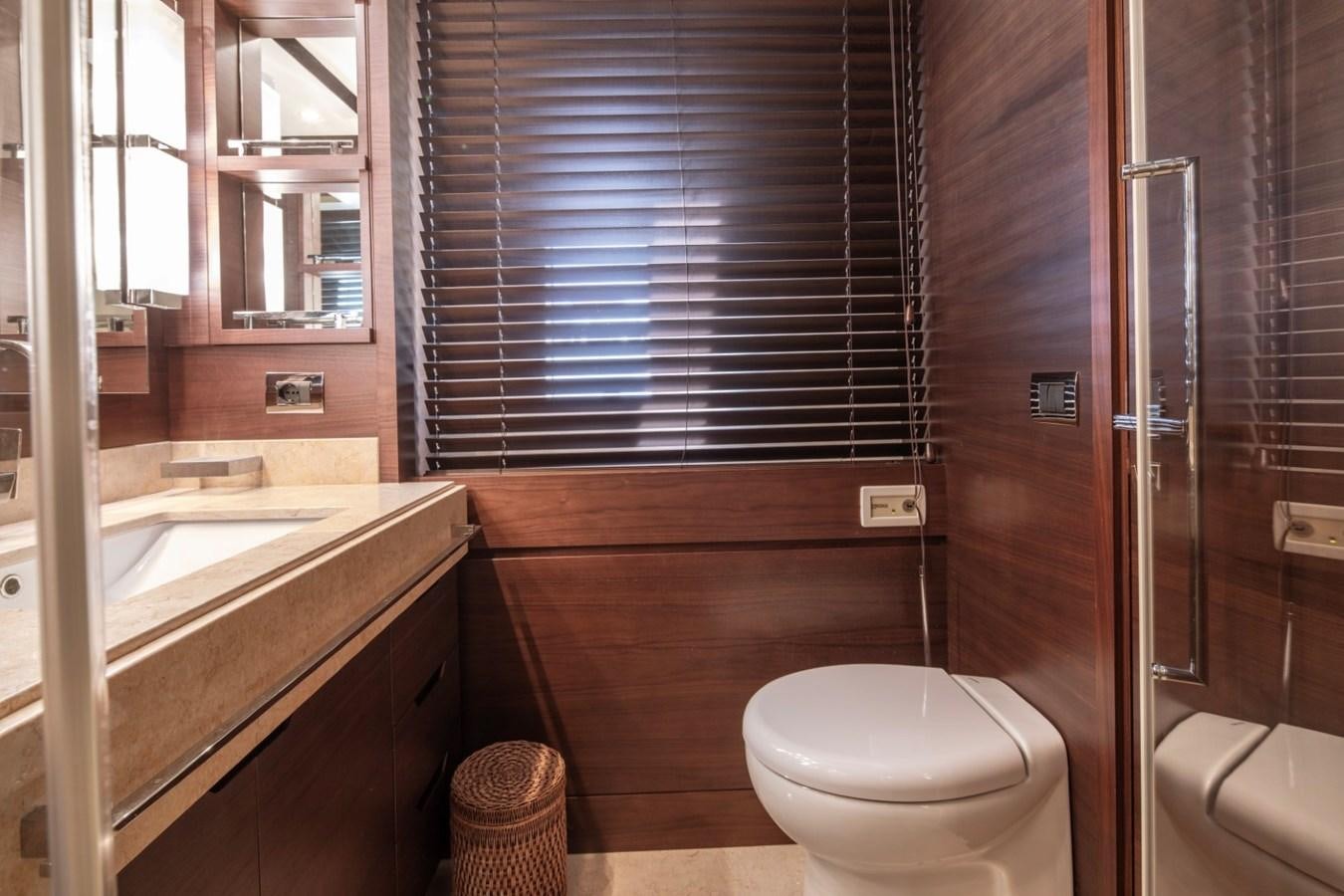 a bathroom with a toilet and sink aboard NIMIR Yacht for Sale