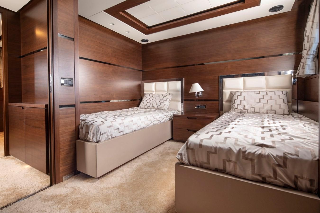 a room with two beds aboard NIMIR Yacht for Sale
