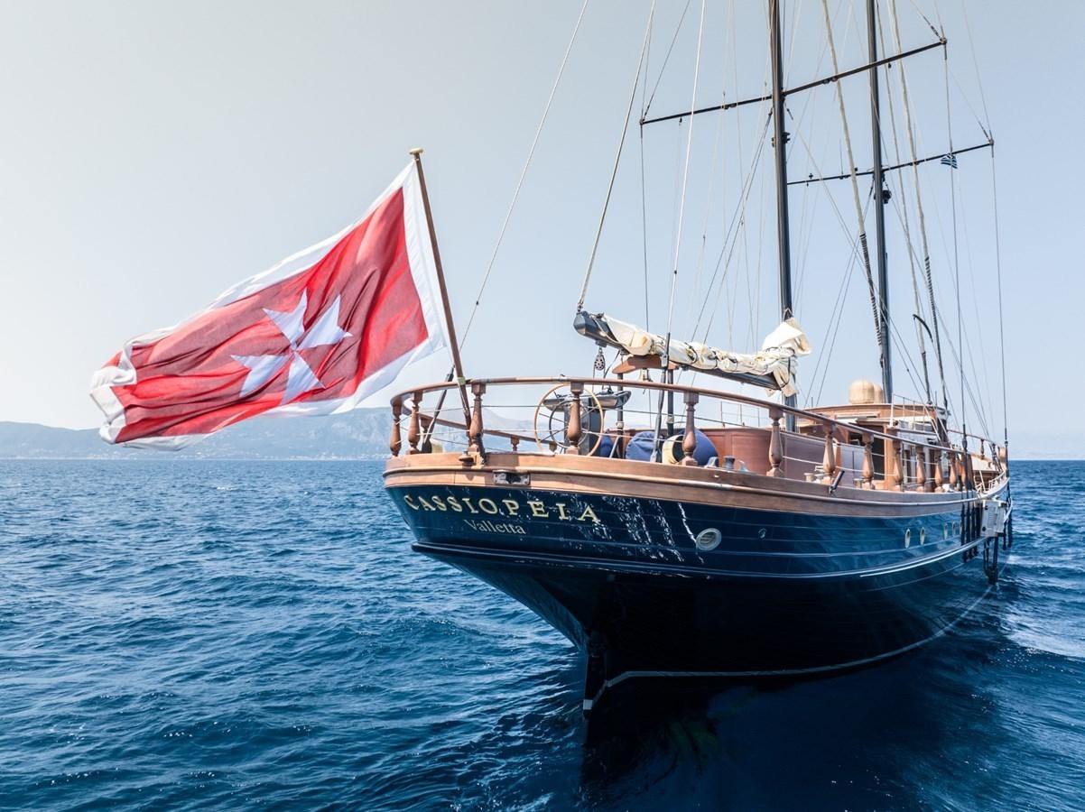 a boat with a flag on it aboard CASSIOPEIA Yacht for Sale