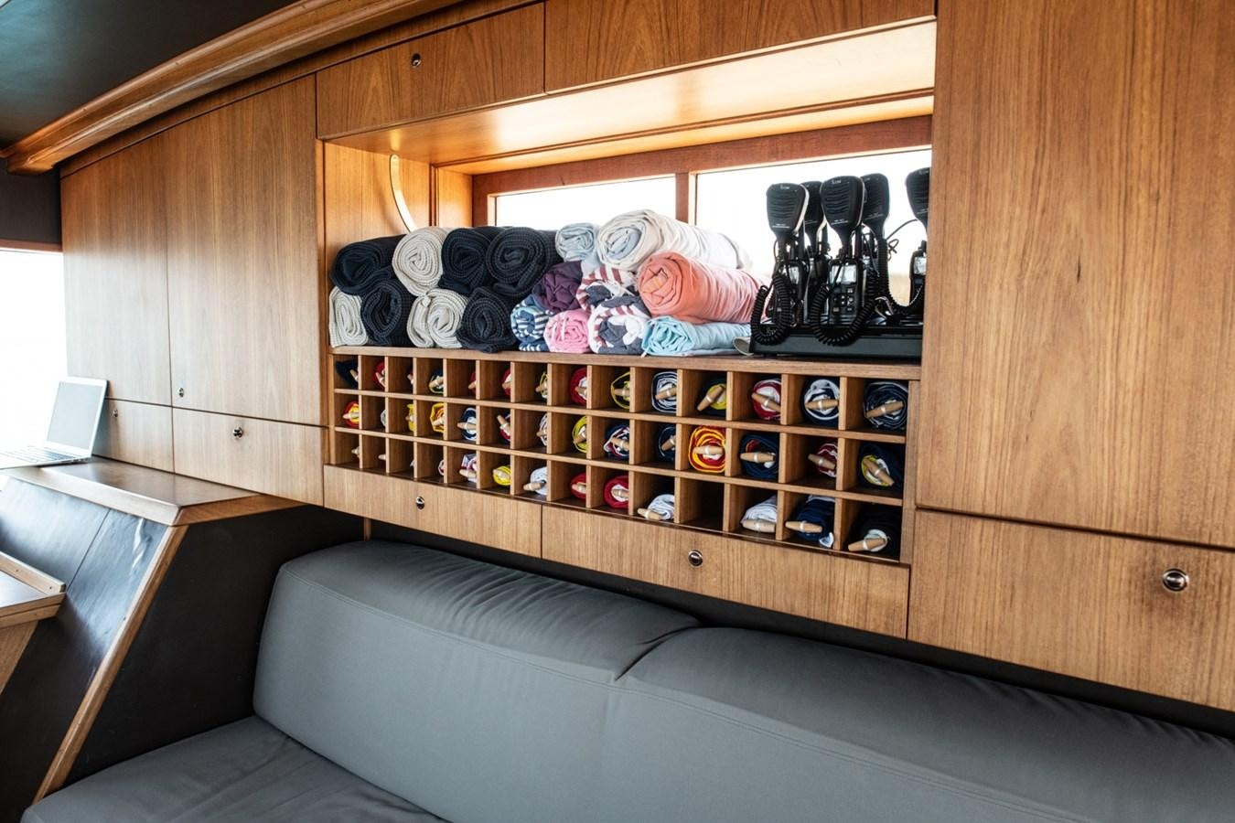 a room with a bed and a desk aboard CASSIOPEIA Yacht for Sale