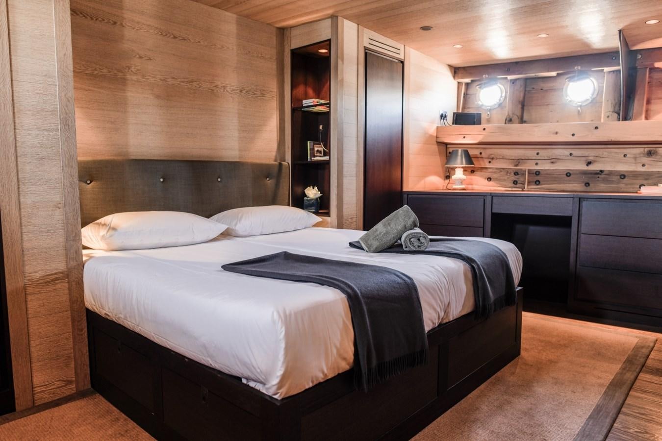 a bed in a room aboard CASSIOPEIA Yacht for Sale