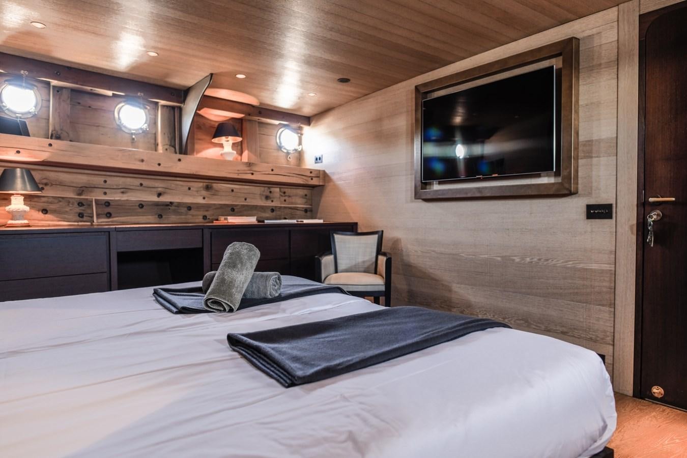 a bed in a room aboard CASSIOPEIA Yacht for Sale