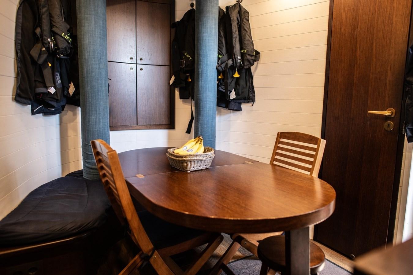 a table with a basket on it aboard CASSIOPEIA Yacht for Sale