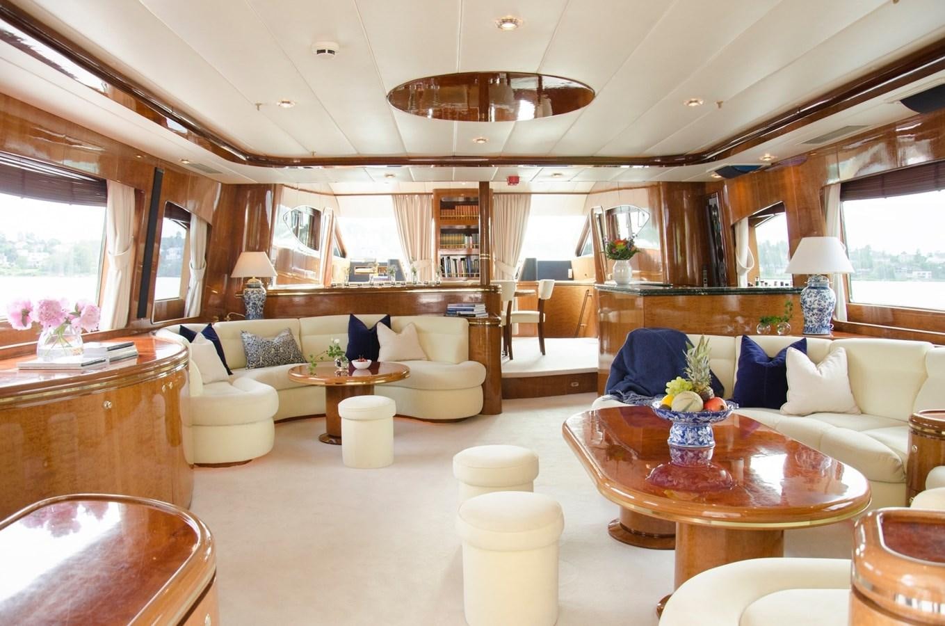 a living room with a large table and chairs aboard MALARPRINSESSAN Yacht for Sale