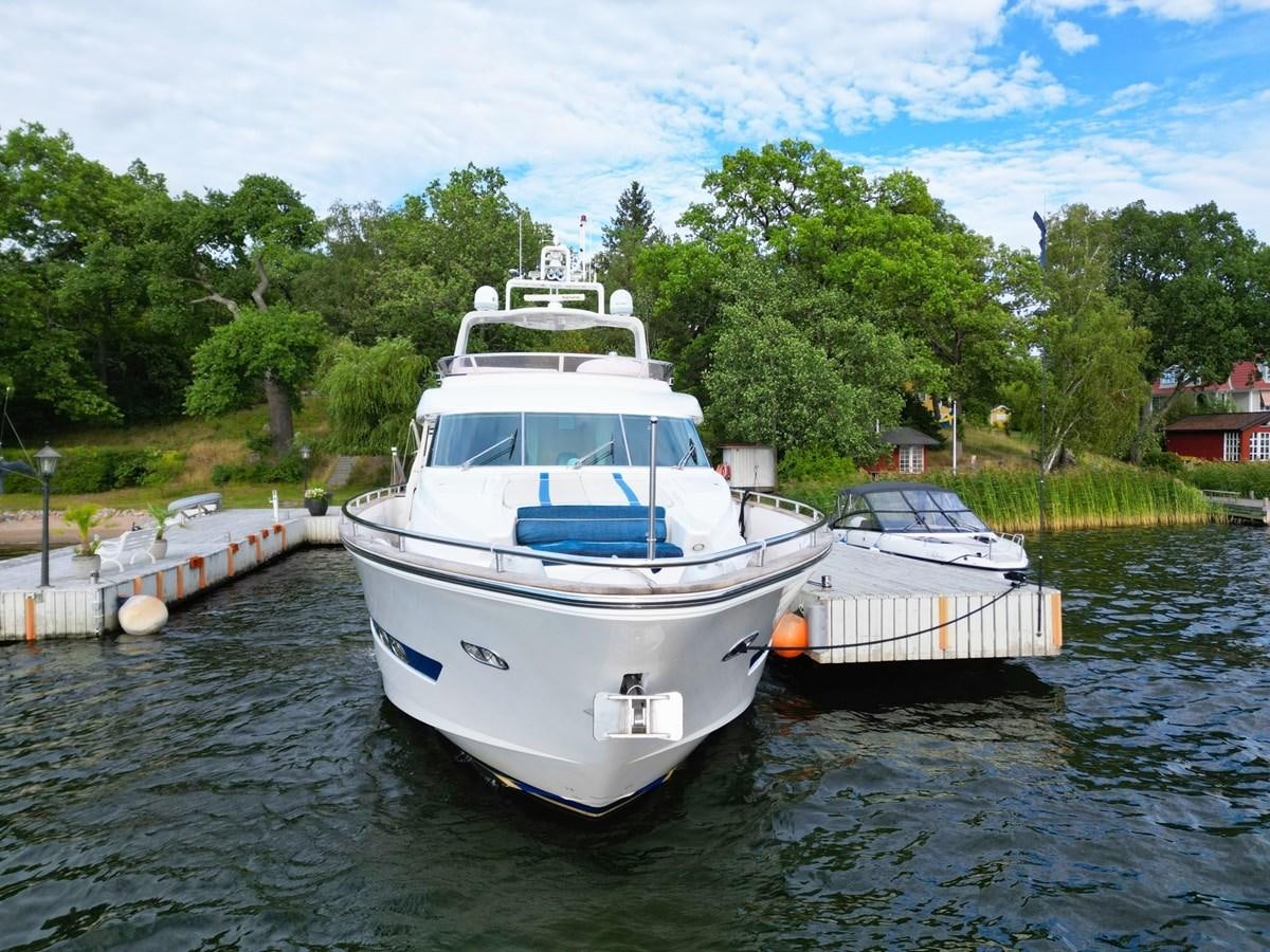 a couple of boats are parked in a river aboard MALARPRINSESSAN Yacht for Sale