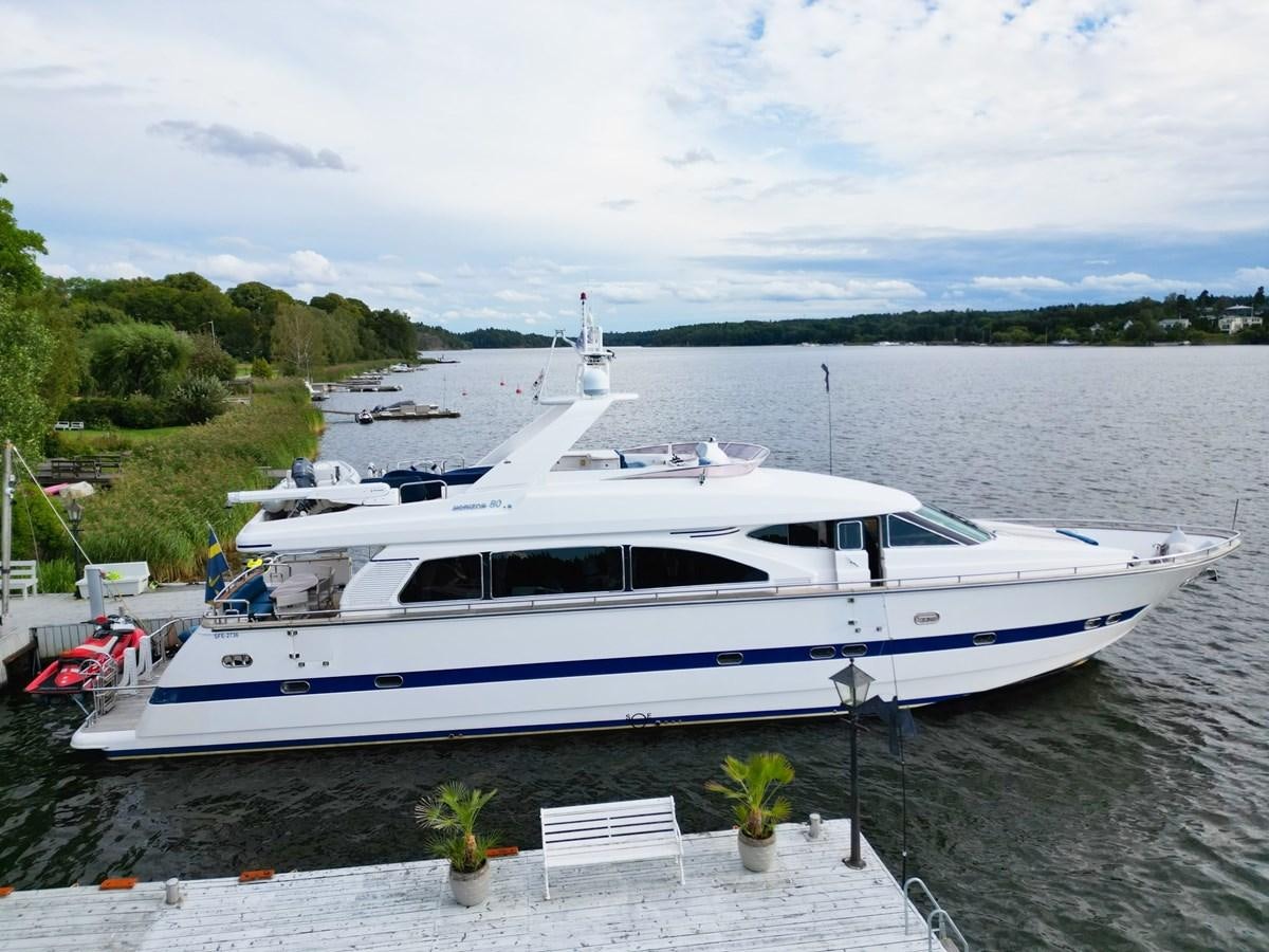a white yacht in a harbor aboard MALARPRINSESSAN Yacht for Sale