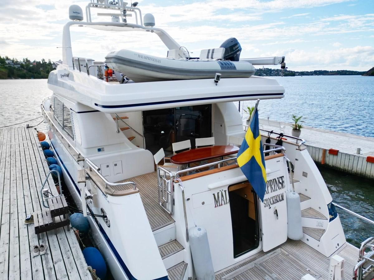 a boat docked at a pier aboard MALARPRINSESSAN Yacht for Sale