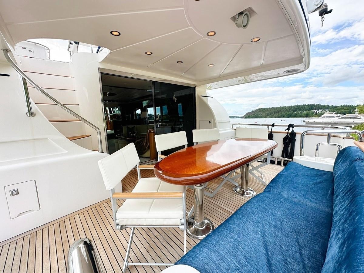 a boat with a table and chairs aboard MALARPRINSESSAN Yacht for Sale