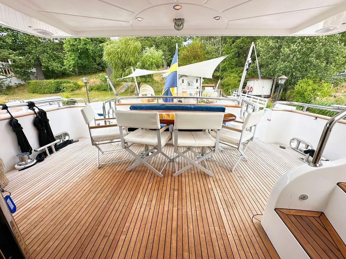 a deck with a pool table and chairs on it aboard MALARPRINSESSAN Yacht for Sale