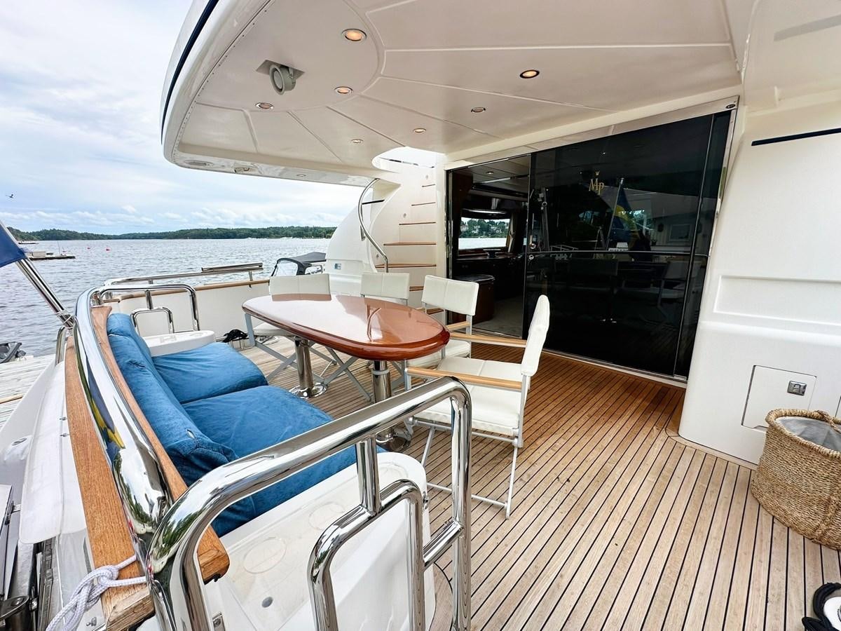 a boat with a table and chairs aboard MALARPRINSESSAN Yacht for Sale