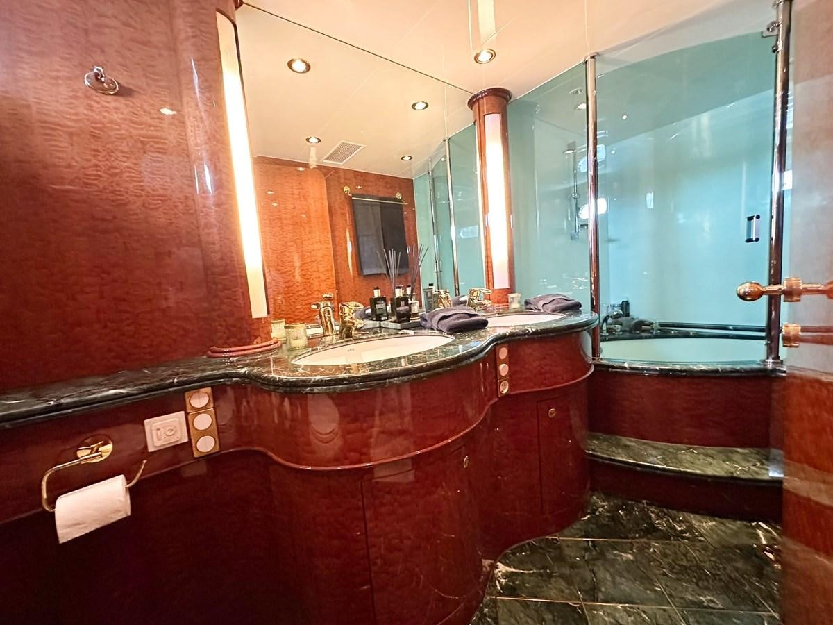 a bathroom with a countertop sink and mirrors aboard MALARPRINSESSAN Yacht for Sale