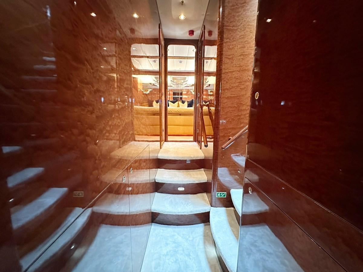 a hallway with a glass door aboard MALARPRINSESSAN Yacht for Sale