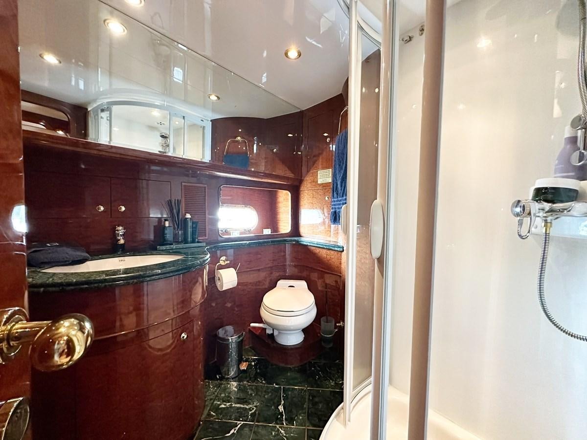 a bathroom with a toilet and a sink aboard MALARPRINSESSAN Yacht for Sale