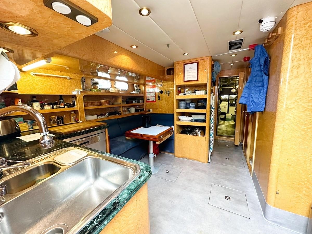 a kitchen with a sink and a counter aboard MALARPRINSESSAN Yacht for Sale