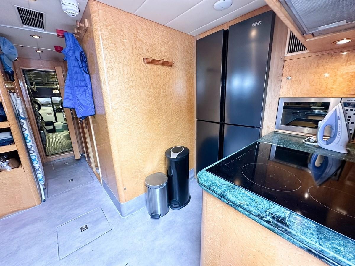 a bathroom with a wood cabinet aboard MALARPRINSESSAN Yacht for Sale