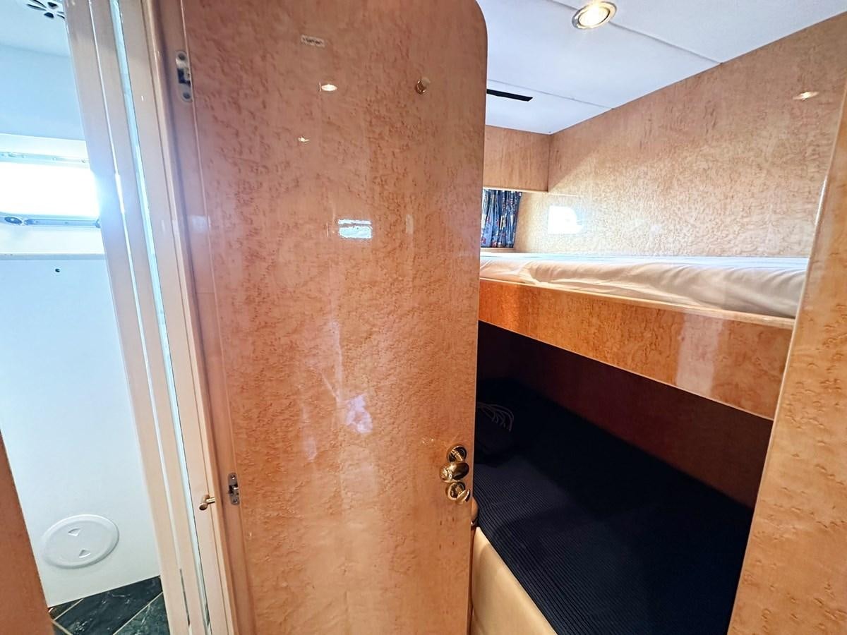 a room with a bed and a door aboard MALARPRINSESSAN Yacht for Sale