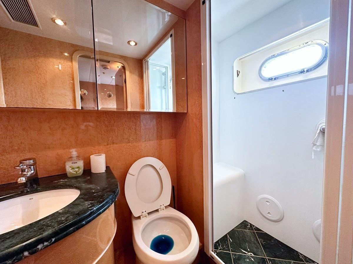 a bathroom with a toilet and a sink aboard MALARPRINSESSAN Yacht for Sale