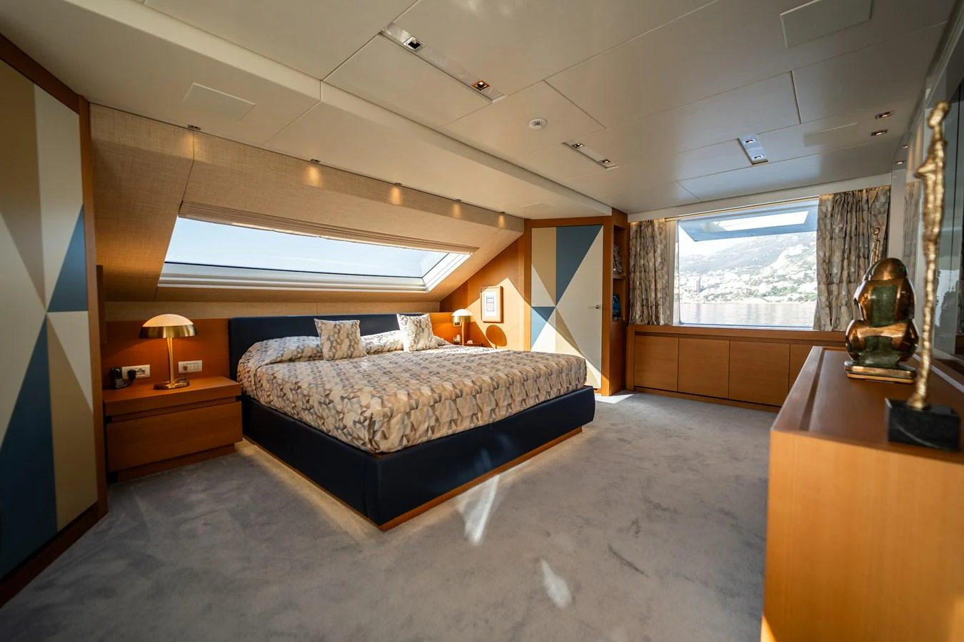 a bedroom with a bed and a desk aboard BLUES Yacht for Sale