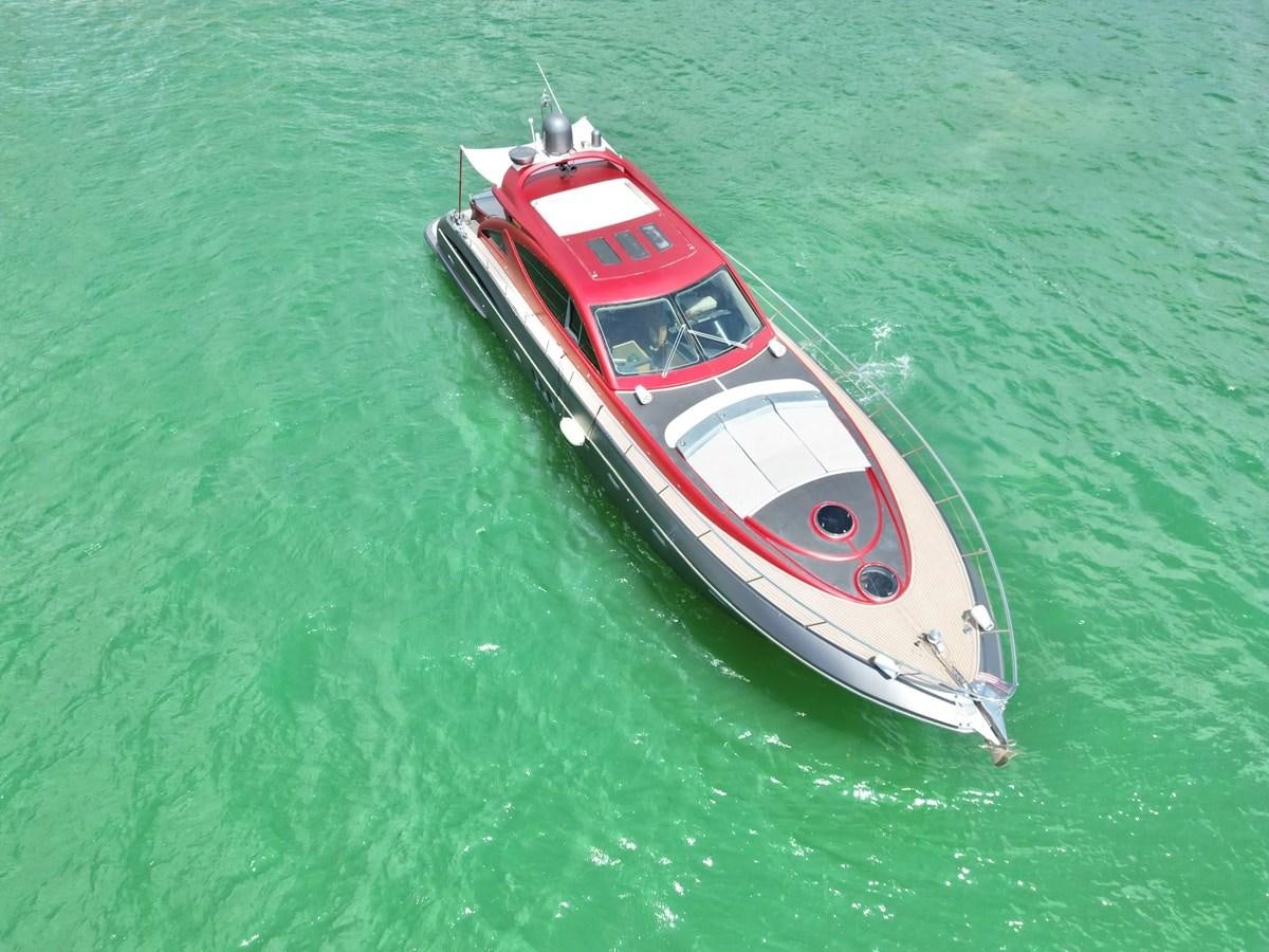 a red and white boat in the water aboard NOTORIUS Yacht for Sale